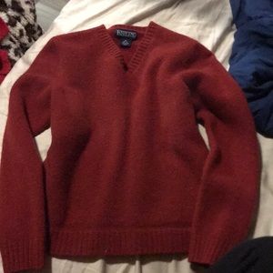 This reddish orange sweater